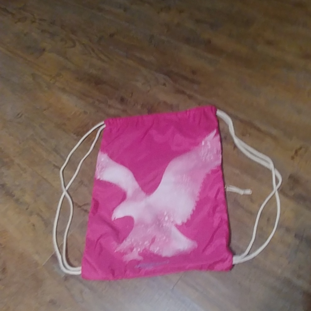 Sling bag with side pocket